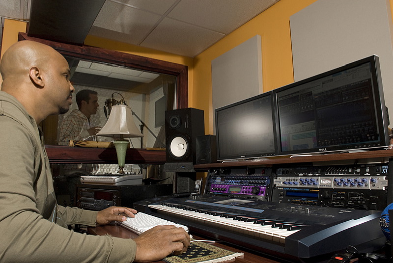 Williams working on some new music in his home studio with songwriting partner Louie Bello. Photo by Marcus C. Eddings, MCE Photography 